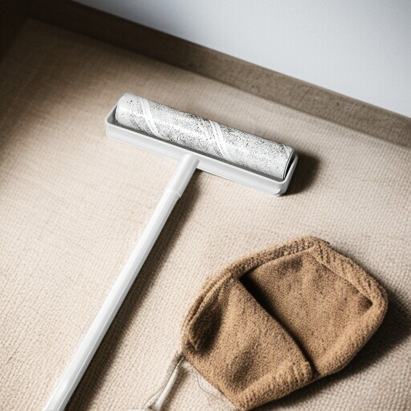 Lint roller removing pet hair from bed