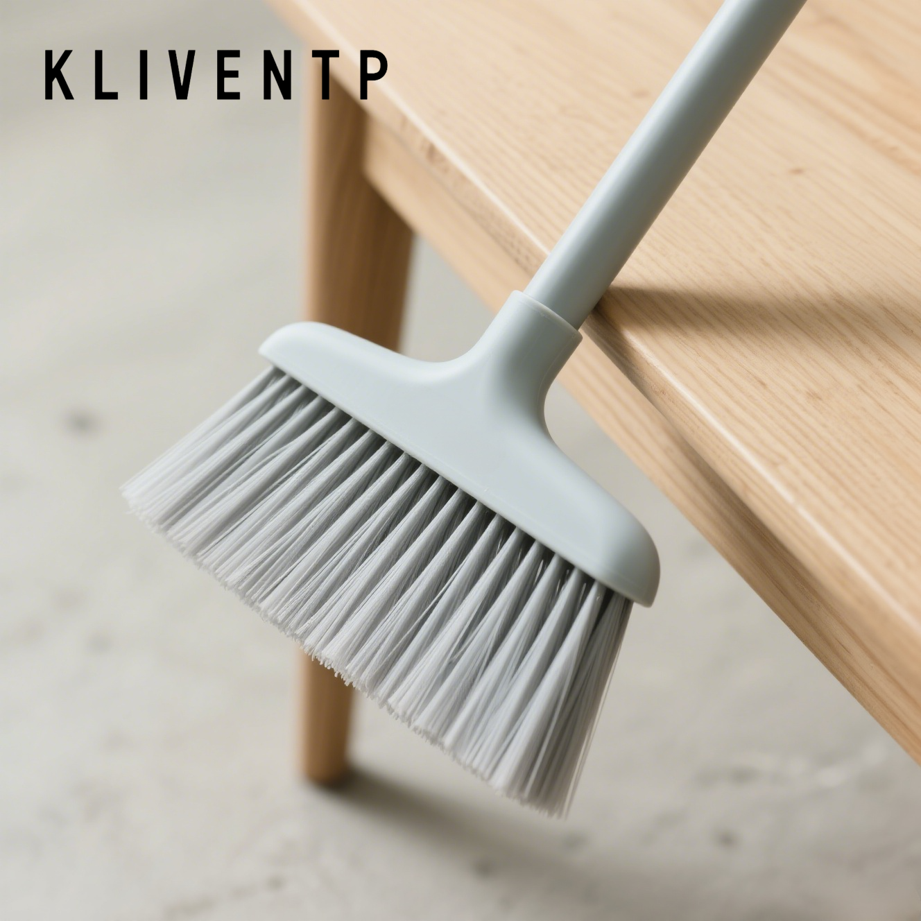 small, soft-bristled broom