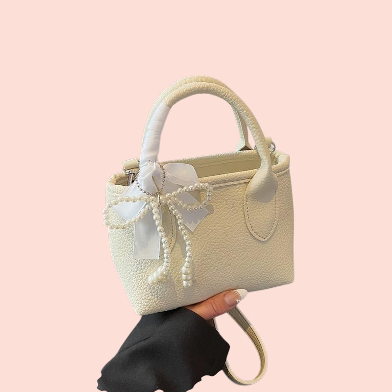 กระเป๋าถือผู้หญิงทรงถัง สีพื้น สไตล์มินิมอล 2025