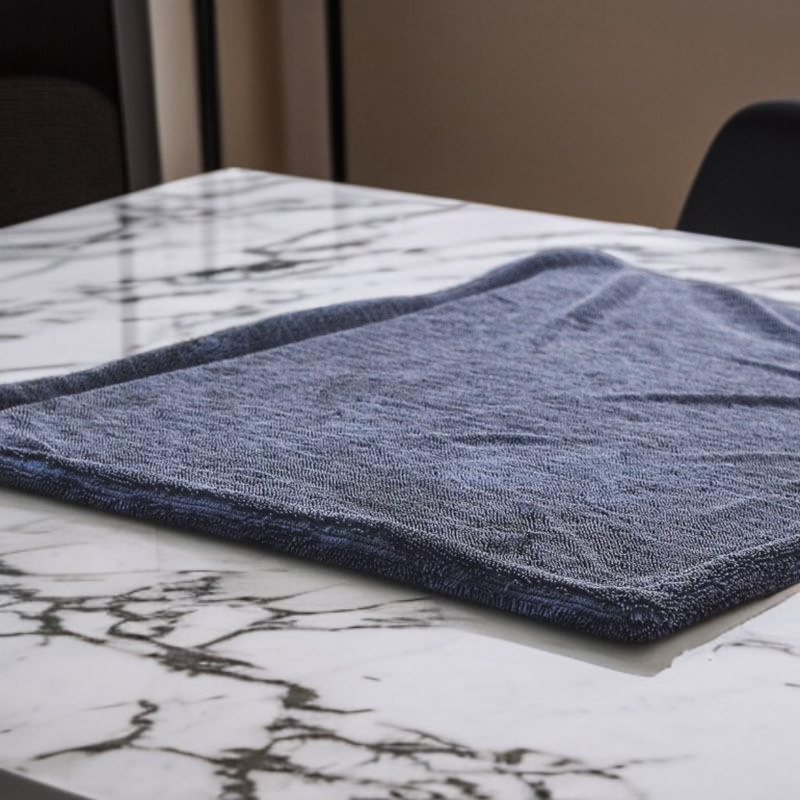 Double sided absorbent edge wrapped cleaning towel