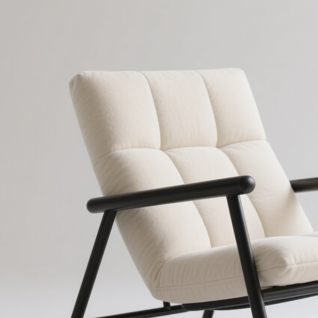 Detalle del tapizado confortable en silla mecedora moderna