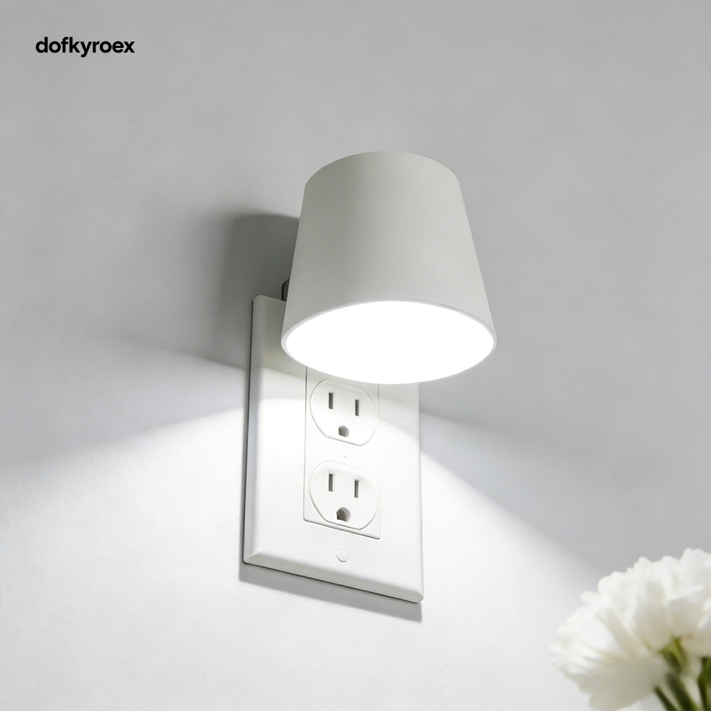 Night light plugged into hallway outlet for safe navigation