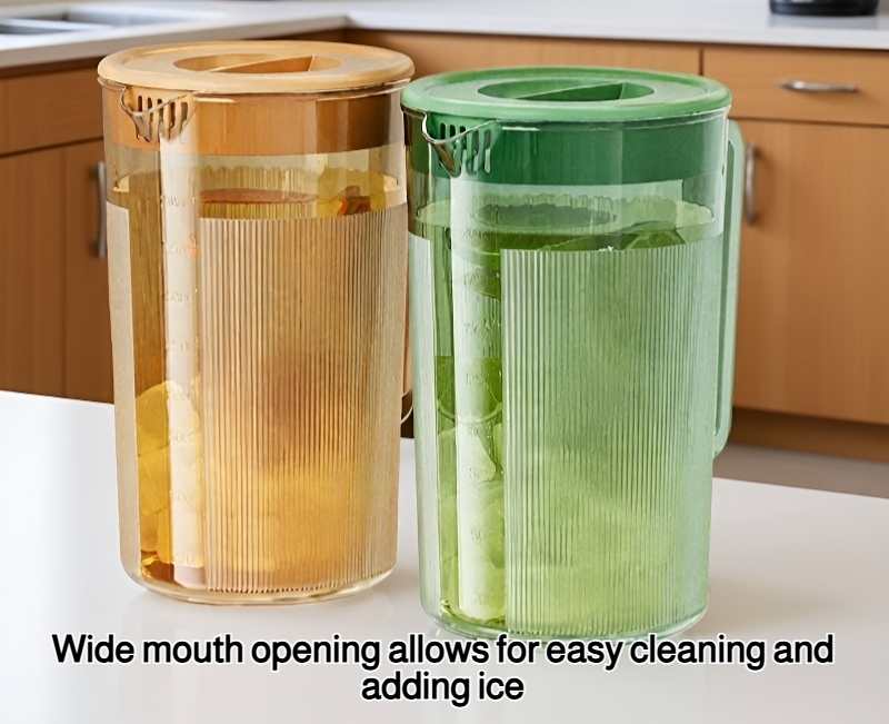 Large glass pitcher filled with iced water and lemon slices