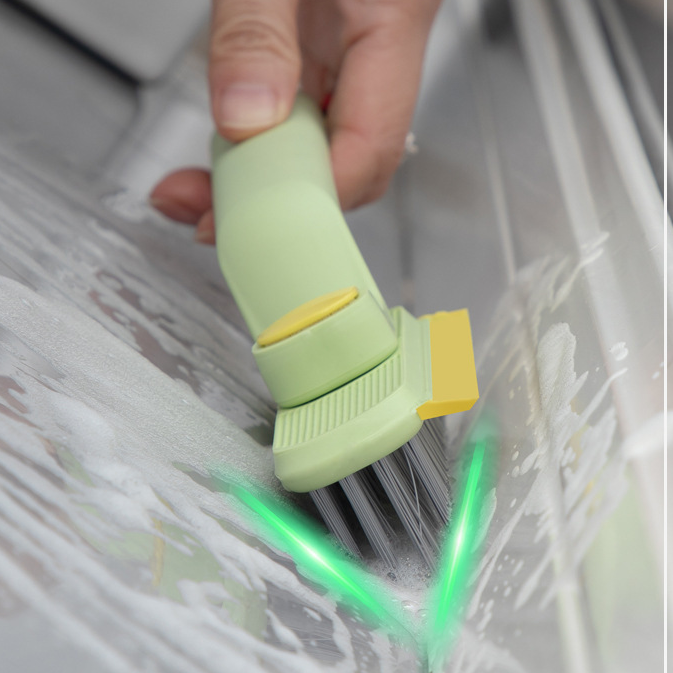 Scrub brush cleaning bathroom floor and wall