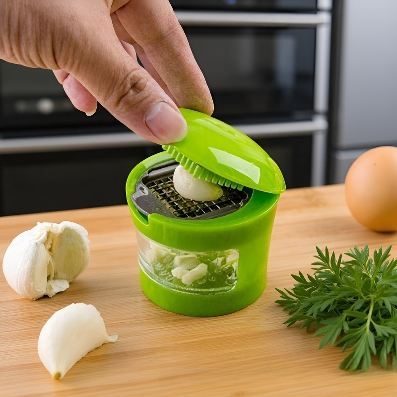 Mini garlic press for kitchen use
