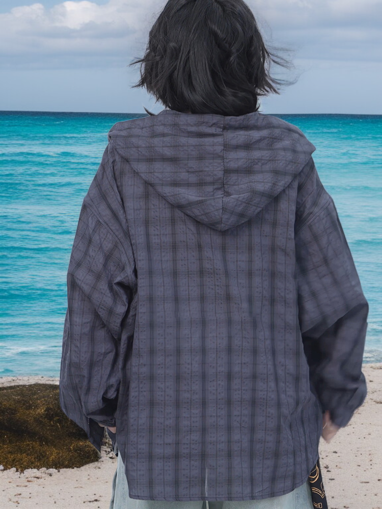 ハンサムな男性モデルが着用するチェック柄長袖シャツ