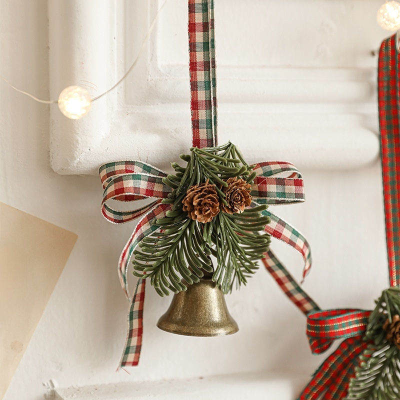 Holiday metal bell and bow ornament
