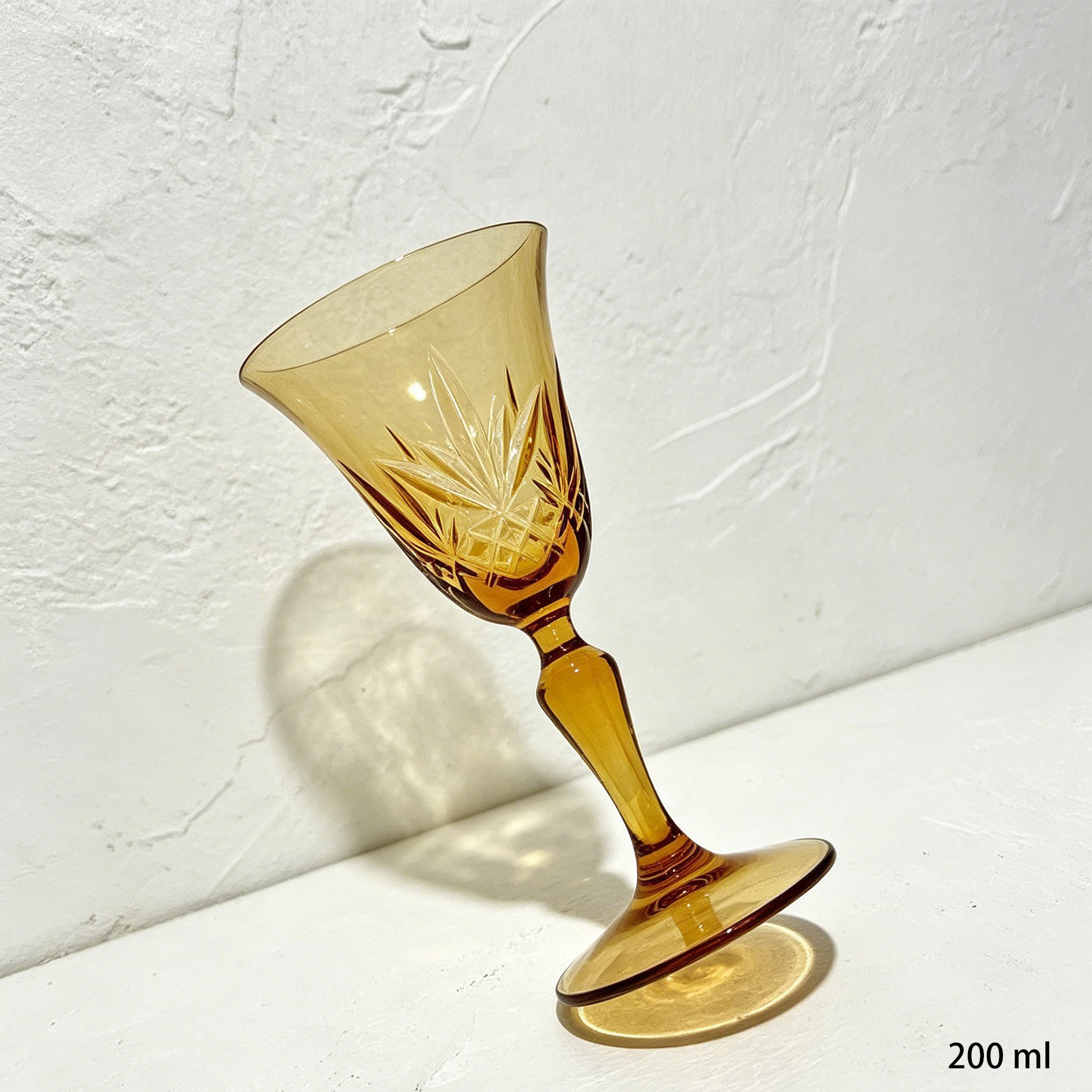 Set of 4 crystal wine glasses displayed on a table