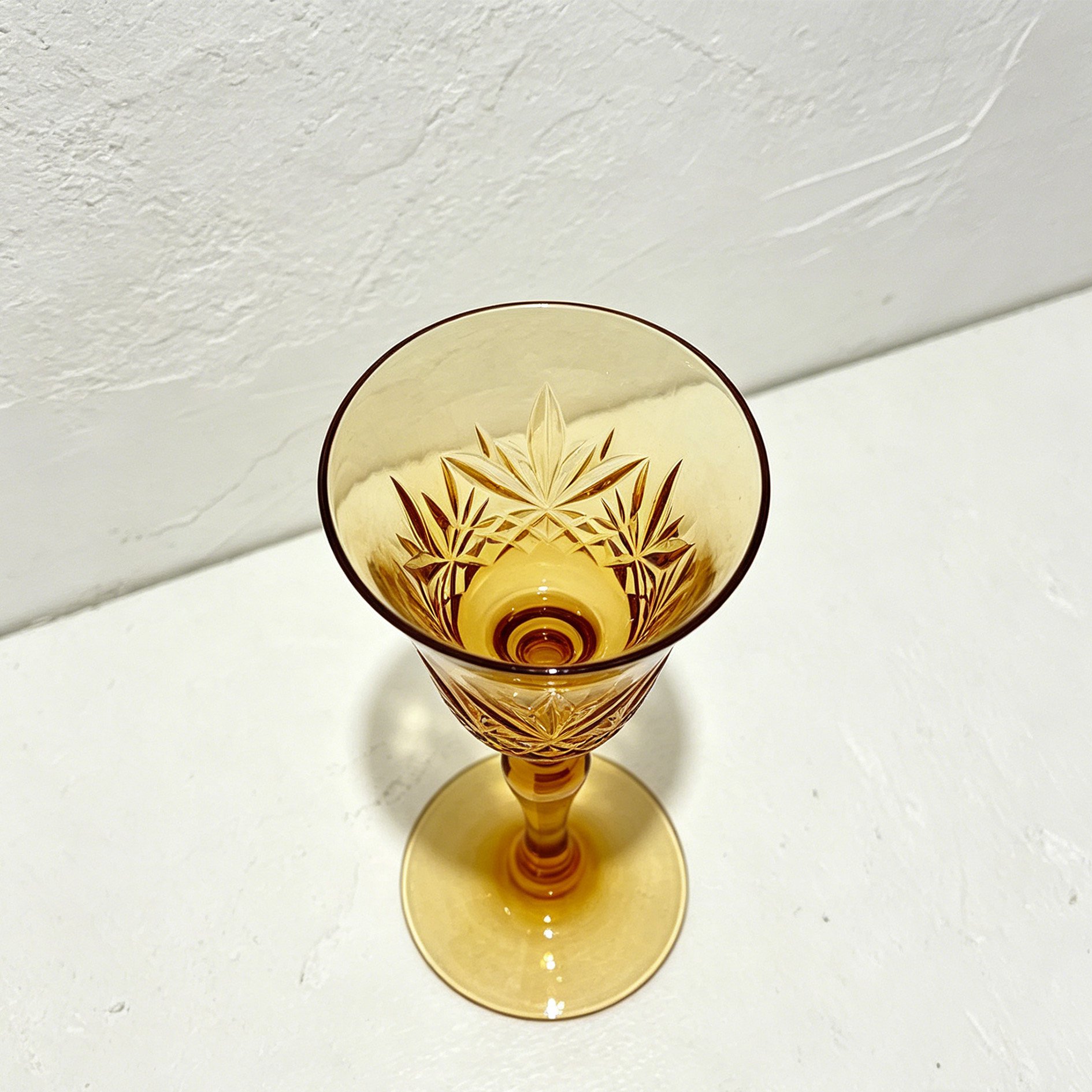 Elegant crystal wine glasses filled with red wine