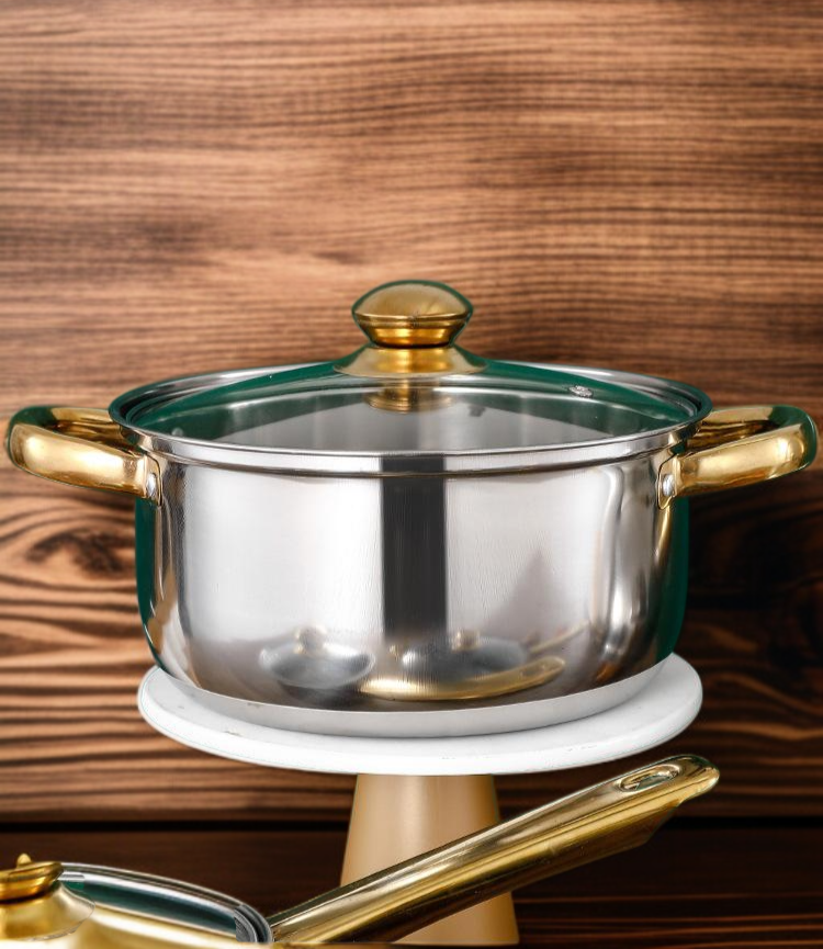 Close-up of gold cookware handles and lids