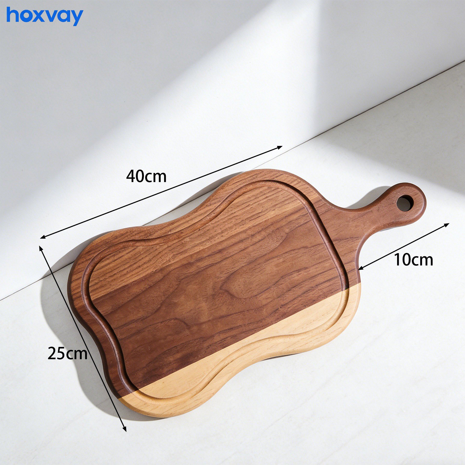 Solid wood chopping board with sliced vegetables