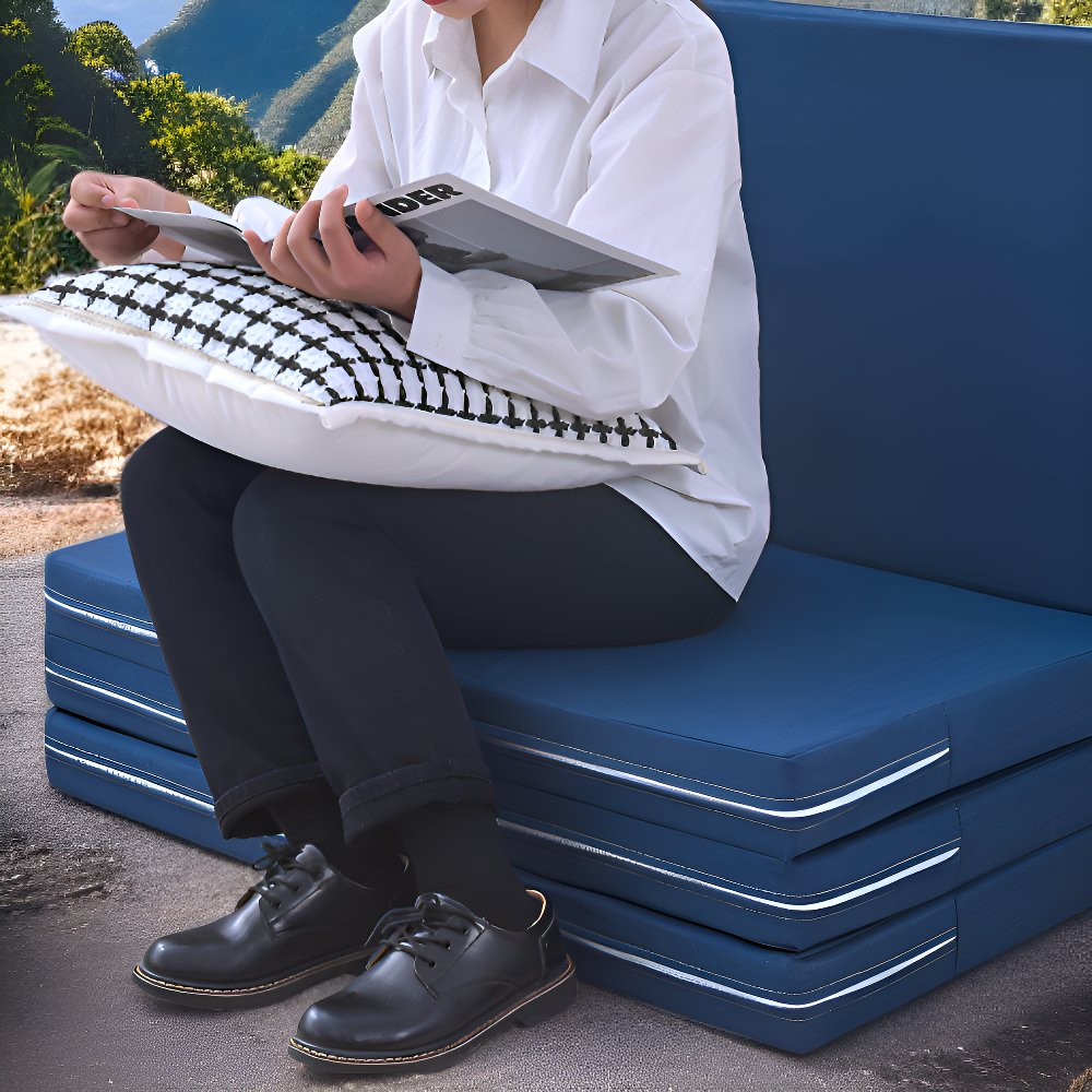 Portable folding mattress for lunch break, perfect for outdoor use.