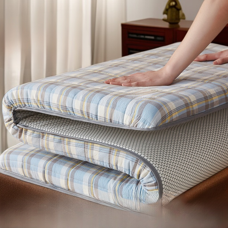 Detalle de funda de colchón tatami ajustada a la cama