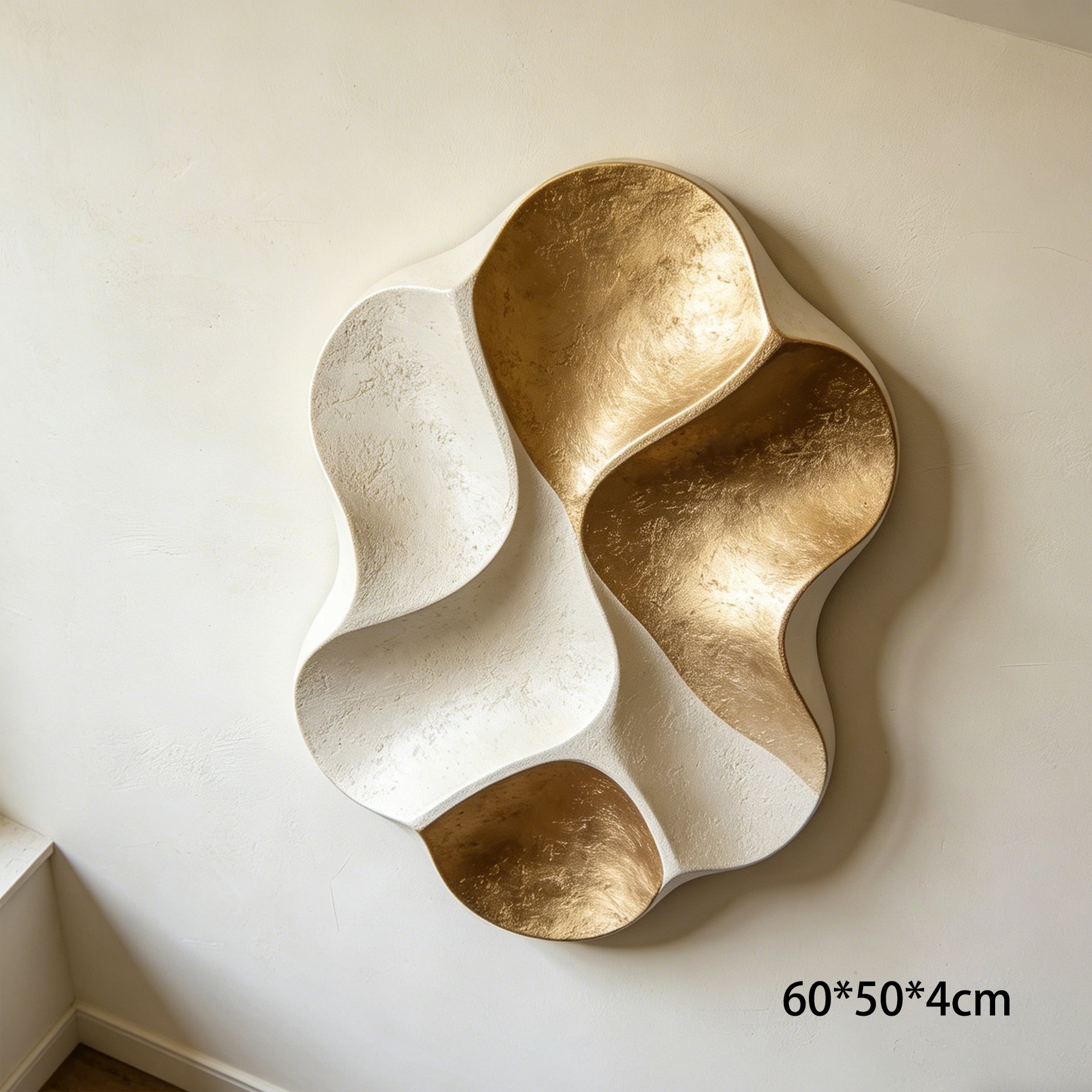 Abstract ivory and gold wall decor above sofa
