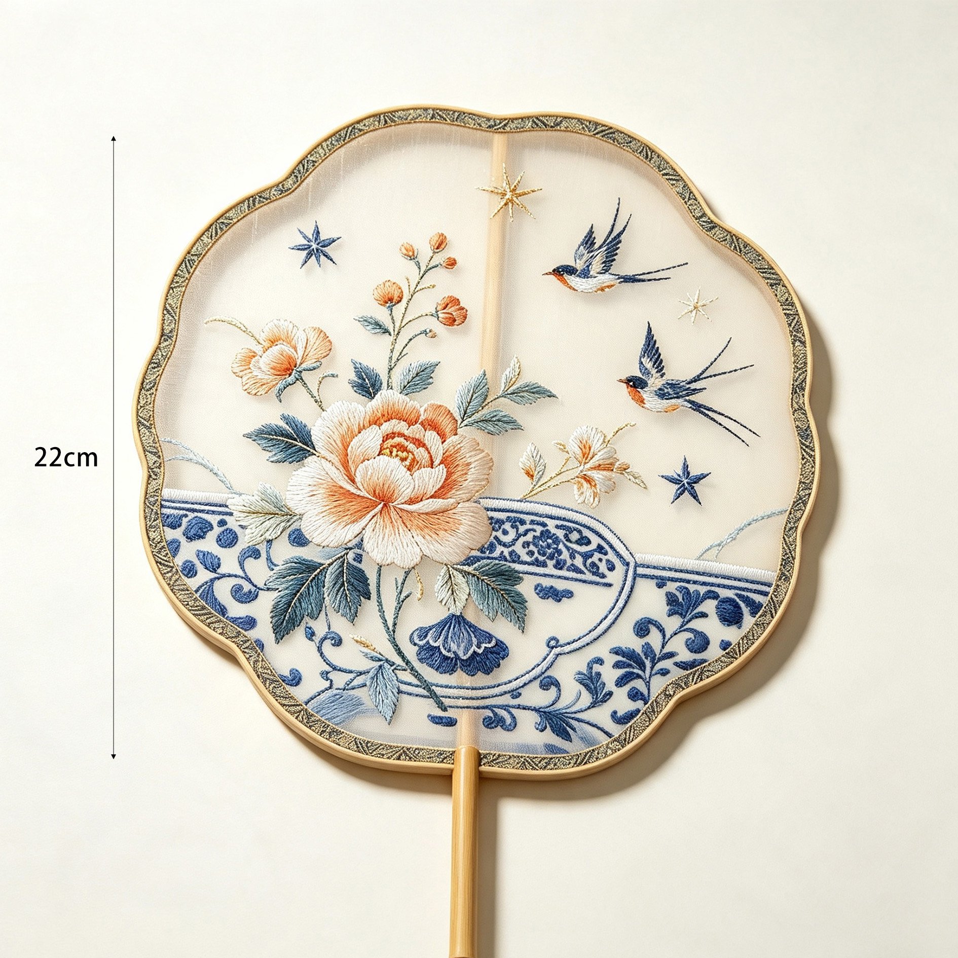 Handcrafted silk fan featuring swallows and lotus flowers
