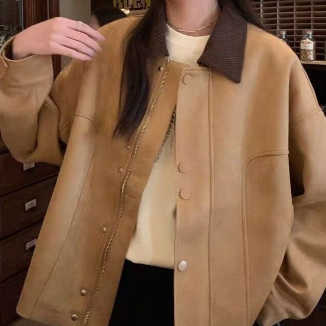 Button collar detail on women's vintage autumn jacket