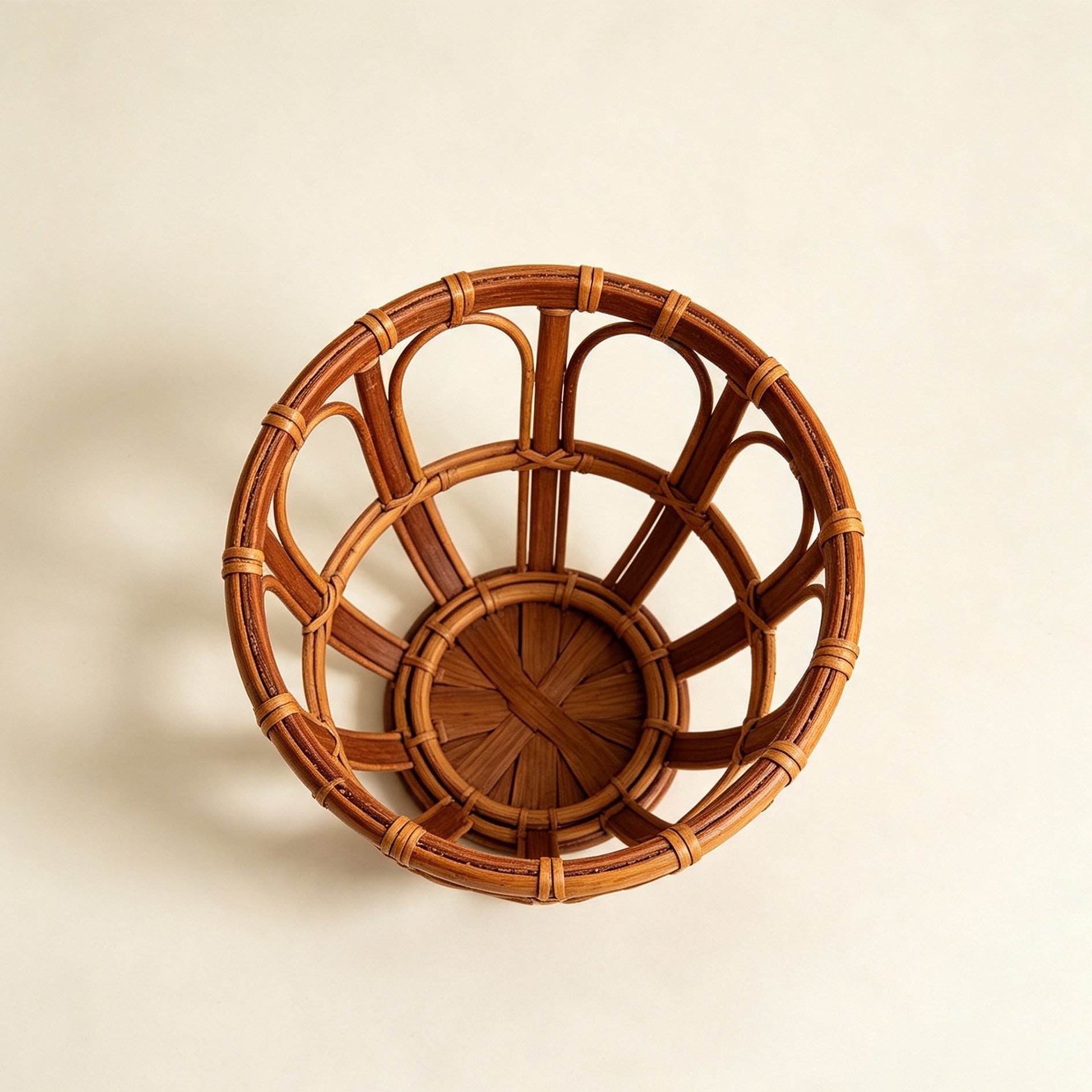 Handwoven rattan round basket on wooden table