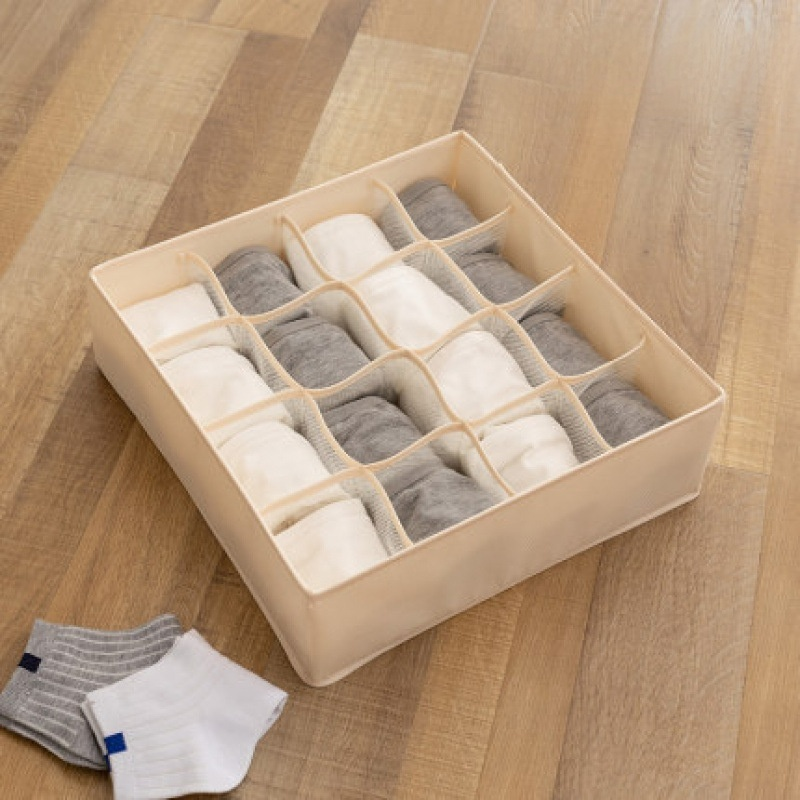 Caja de almacenamiento con divisor de tela