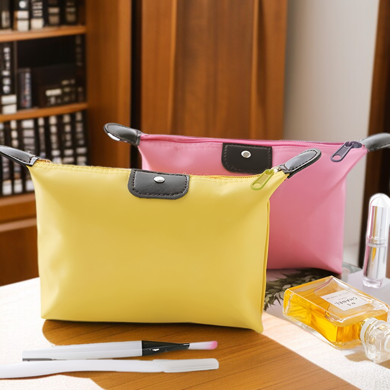 Bolsa mini impermeable para cosméticos y labiales de viaje para mujer con diseño de empanadilla