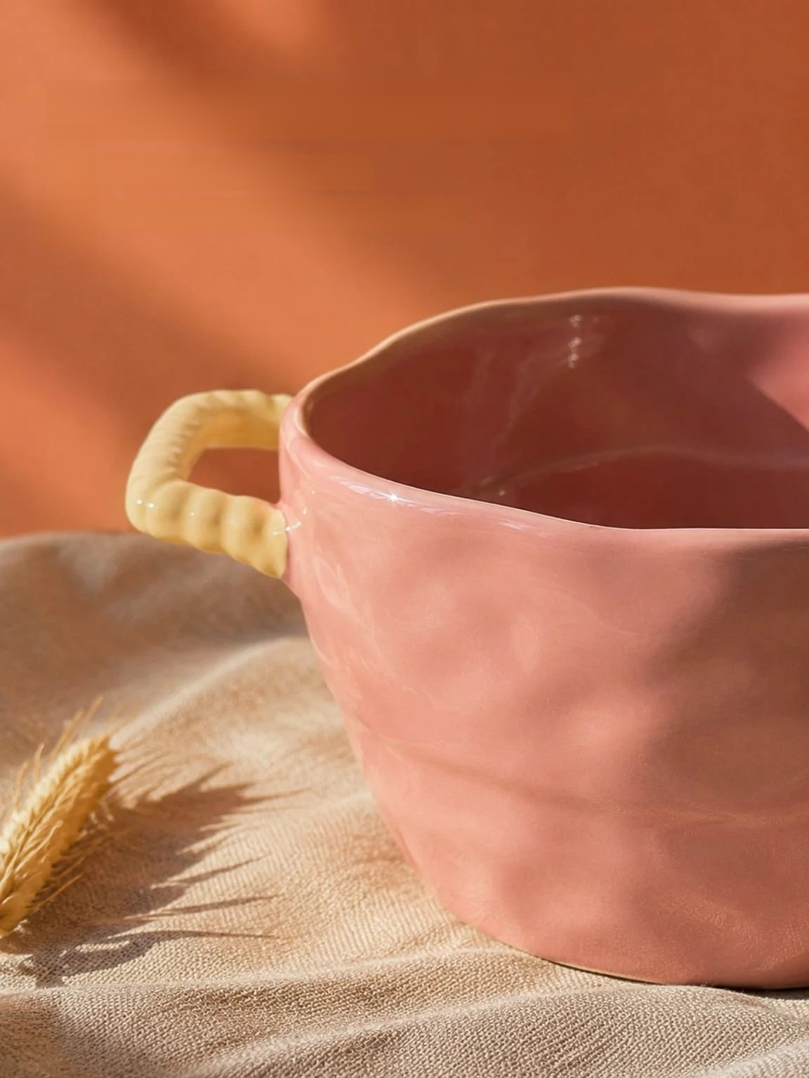 Ceramic serving bowl with two handles for easy carrying