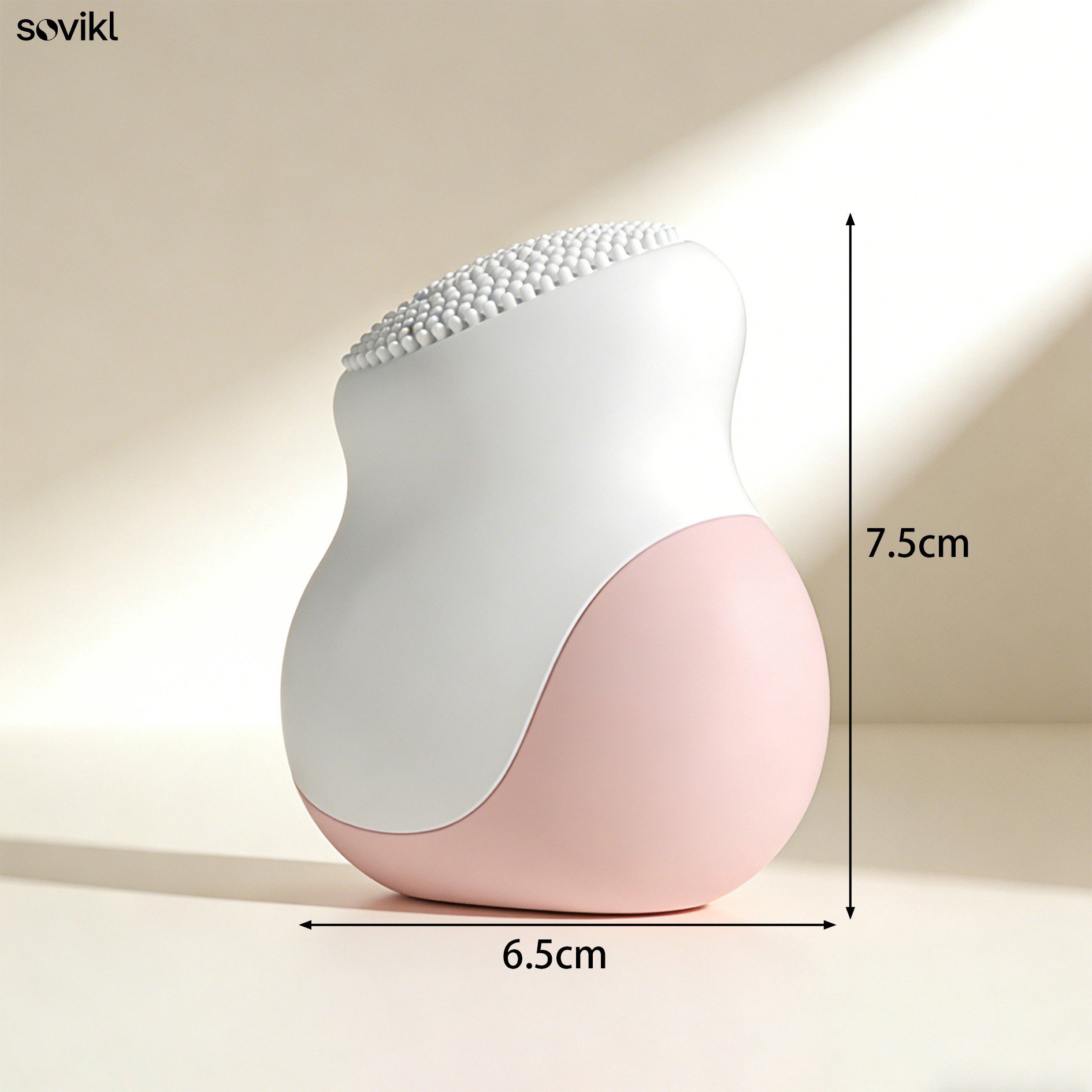 Waterproof facial cleansing tool in pink and white