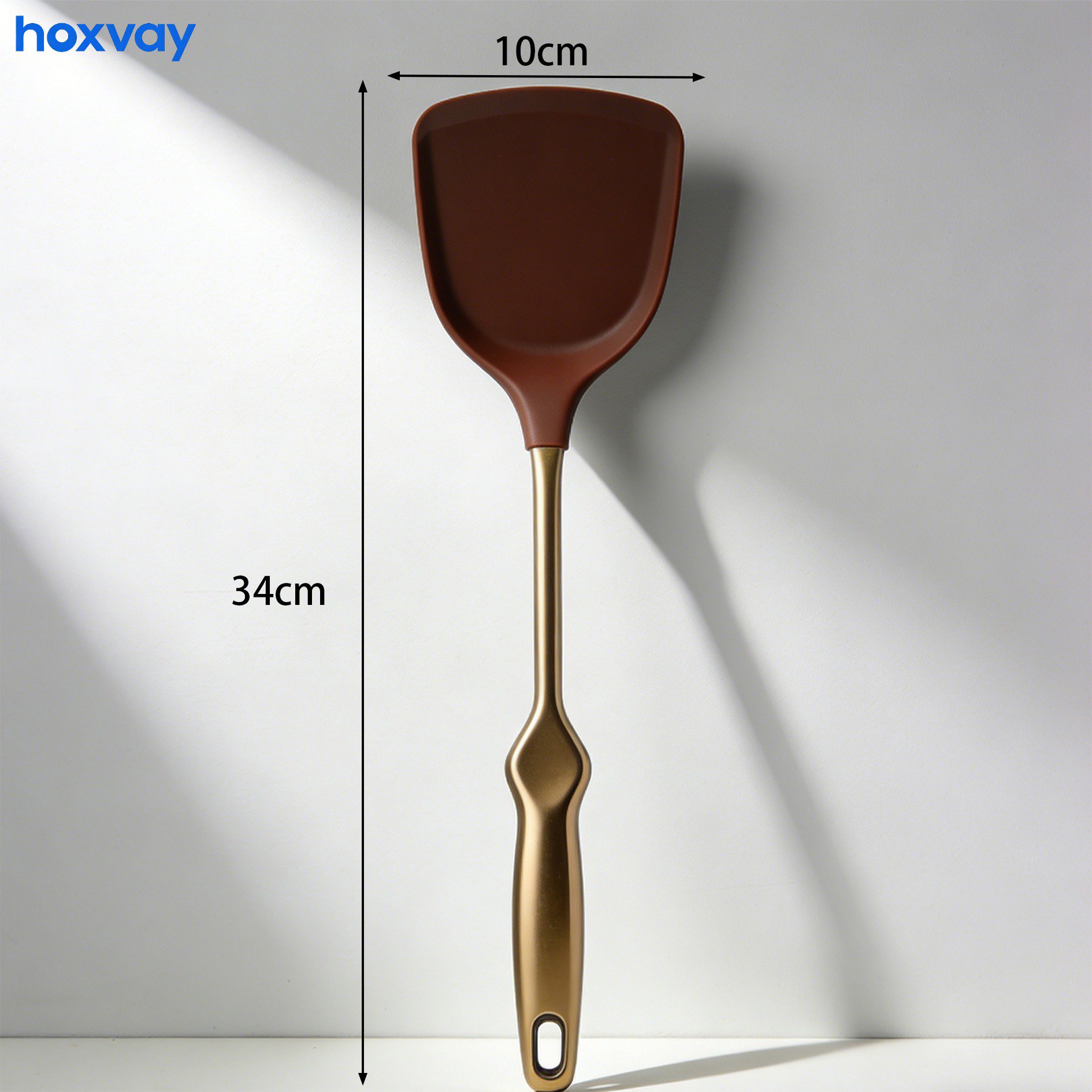 Spatula flipping pancakes on a pan