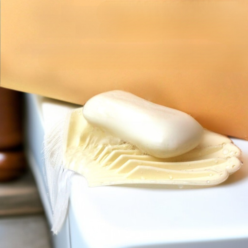 Jabonera de goma blanda con forma de concha y drenaje