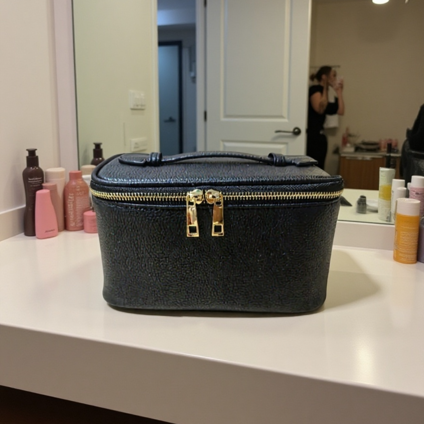 Portable cosmetic bag with handle for easy carrying