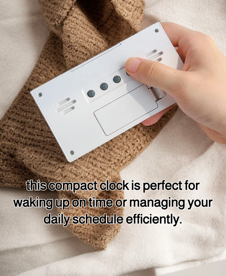 Compact alarm clock showing temperature and humidity