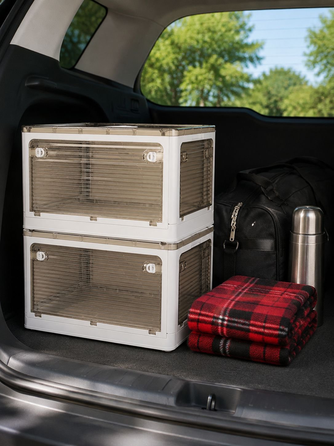 Transparent storage box showing organized clothes inside