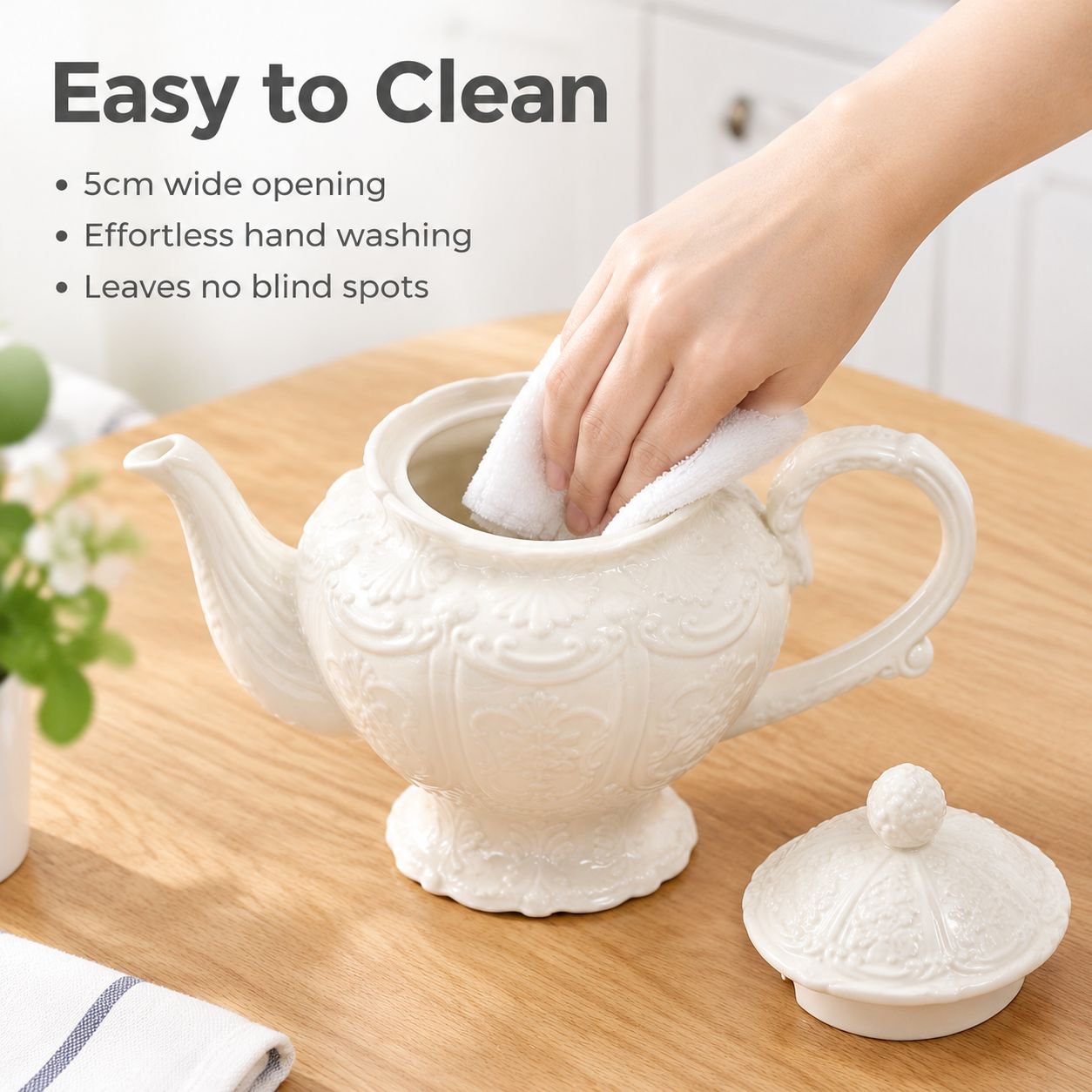 French vintage cream-colored ceramic teapot with raised relief