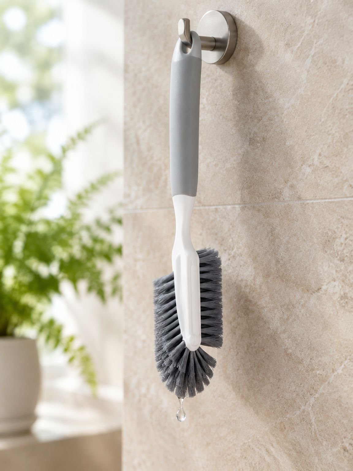 Shoe care cleaning tool with soft bristles and a long handle