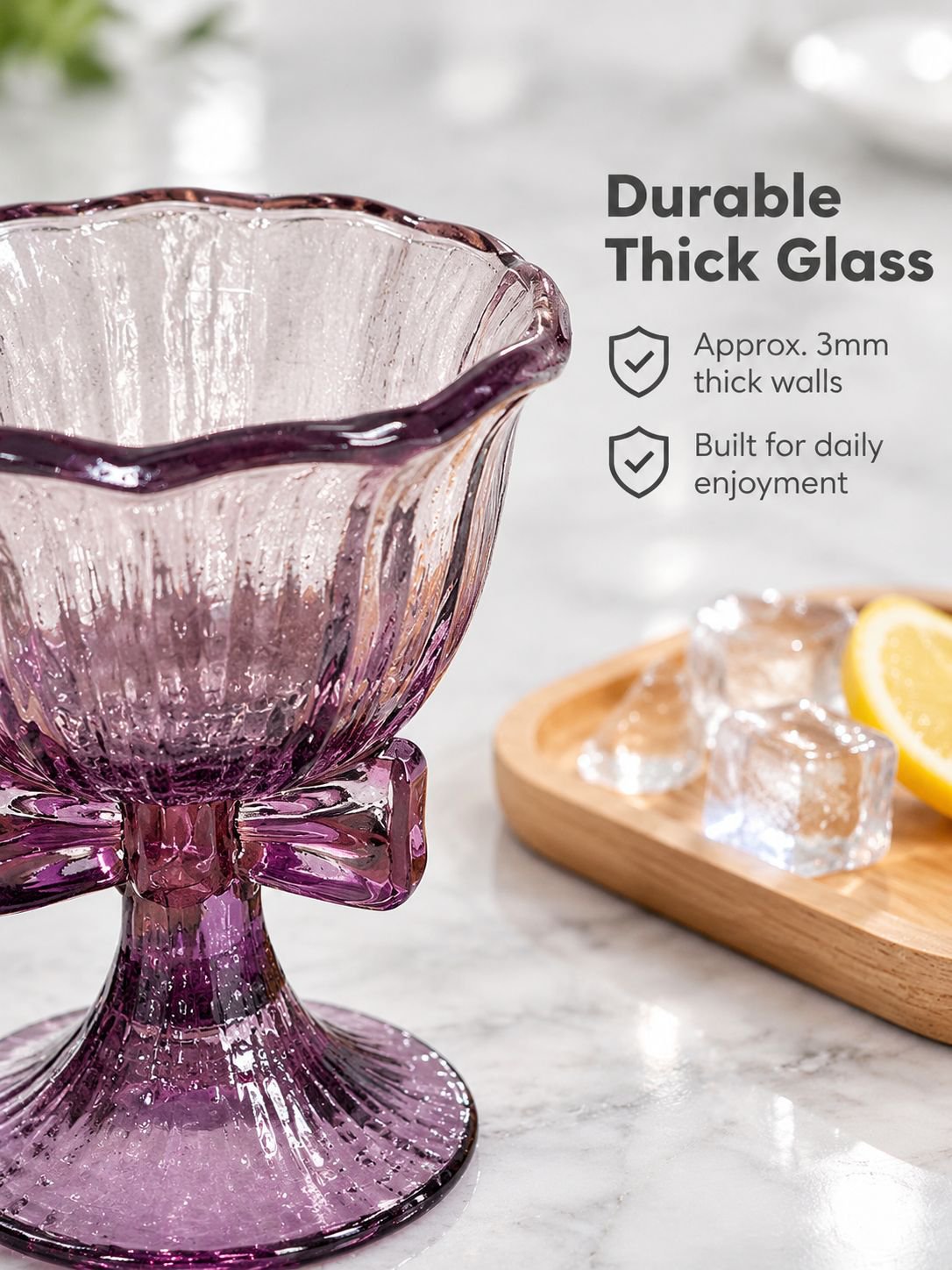 Close-up of the decorative purple bow on a high-stem glass