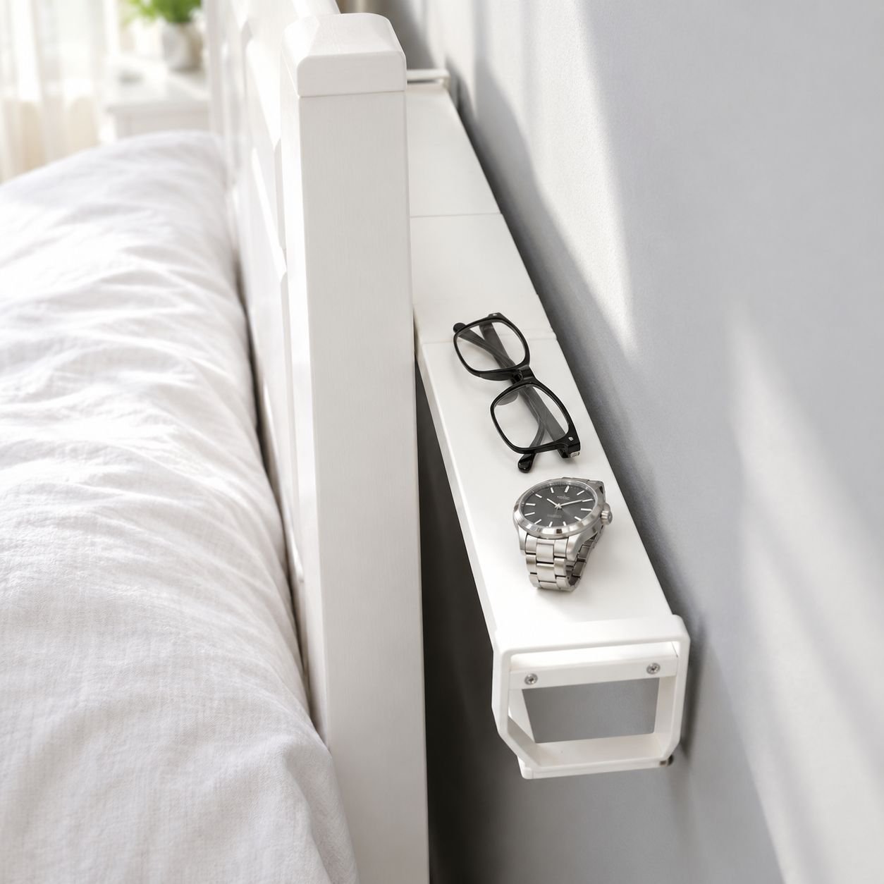 White narrow gap shelf holding phone and glasses