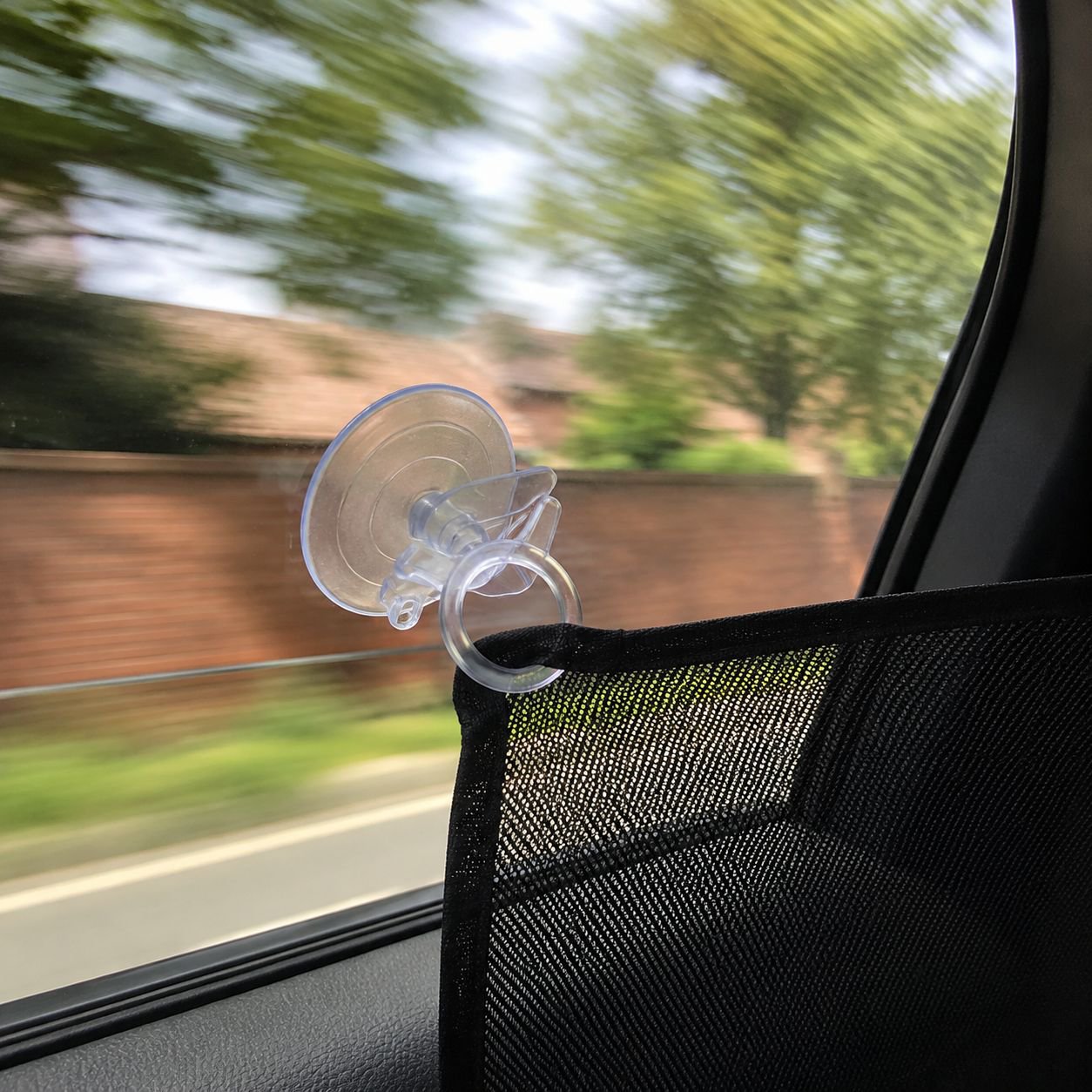 Effortless car curtain mounting with suction cup