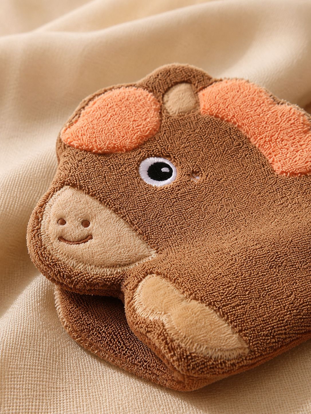 Cartoon horse soft hand towel hanging in bathroom