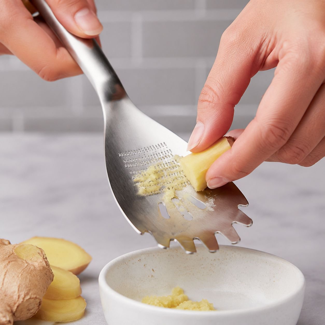 Close-up of stainless steel grinding spoon with ergonomic handle
