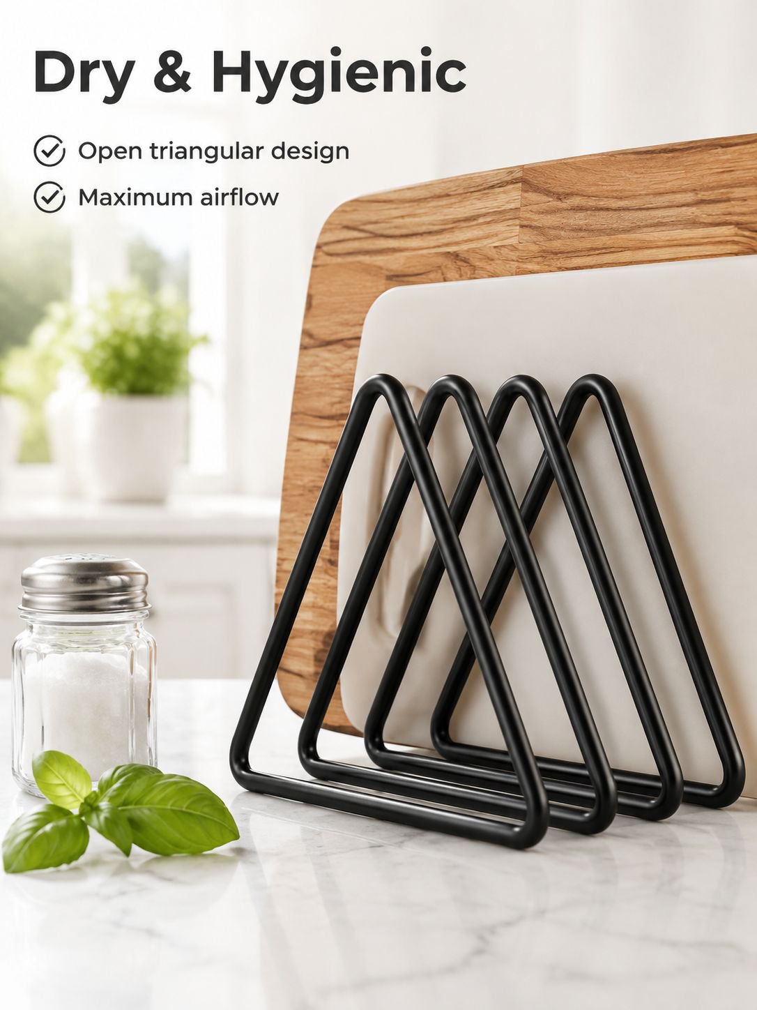 Black iron cutting board storage stand beside kitchen accessories