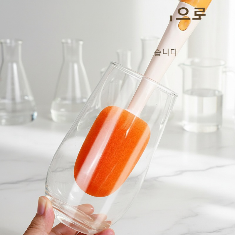 Ergonomic long handle brush scrubbing a glass cup