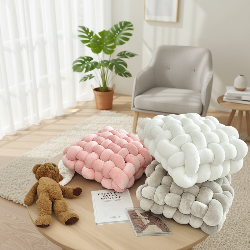 Soft woven knot cushion in stylish home interior
