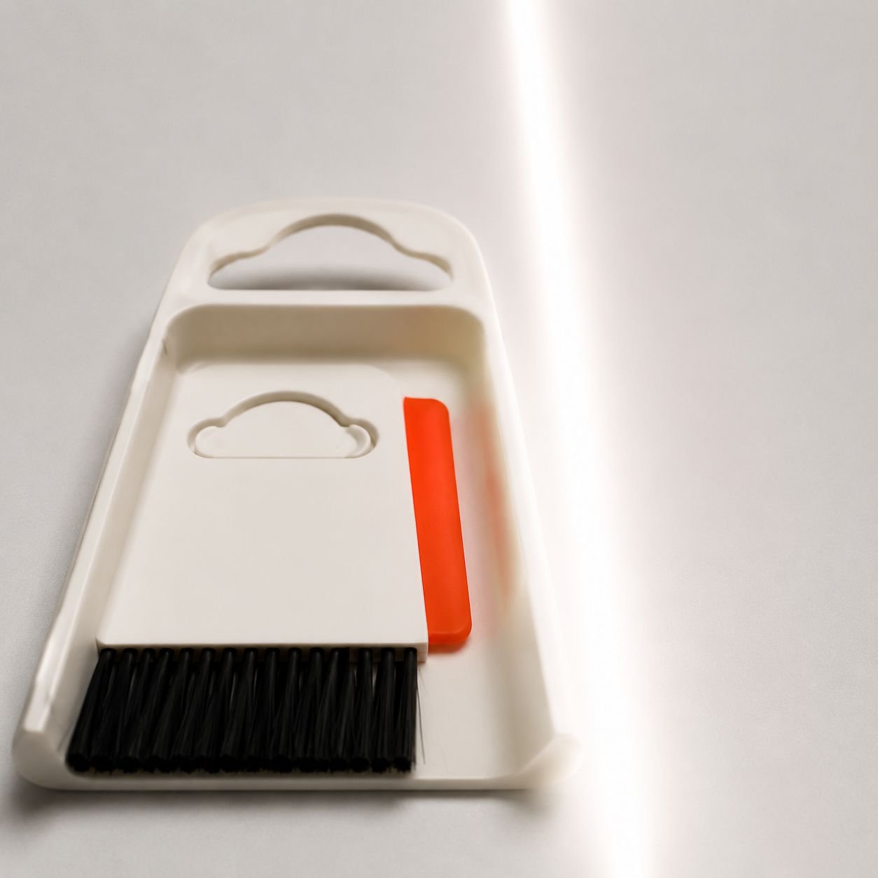 Easy-to-store broom and dustpan set for workspace