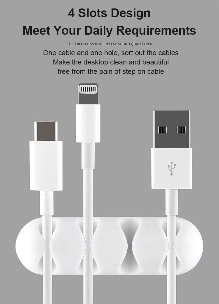Self-adhesive cable clips attached to desktop